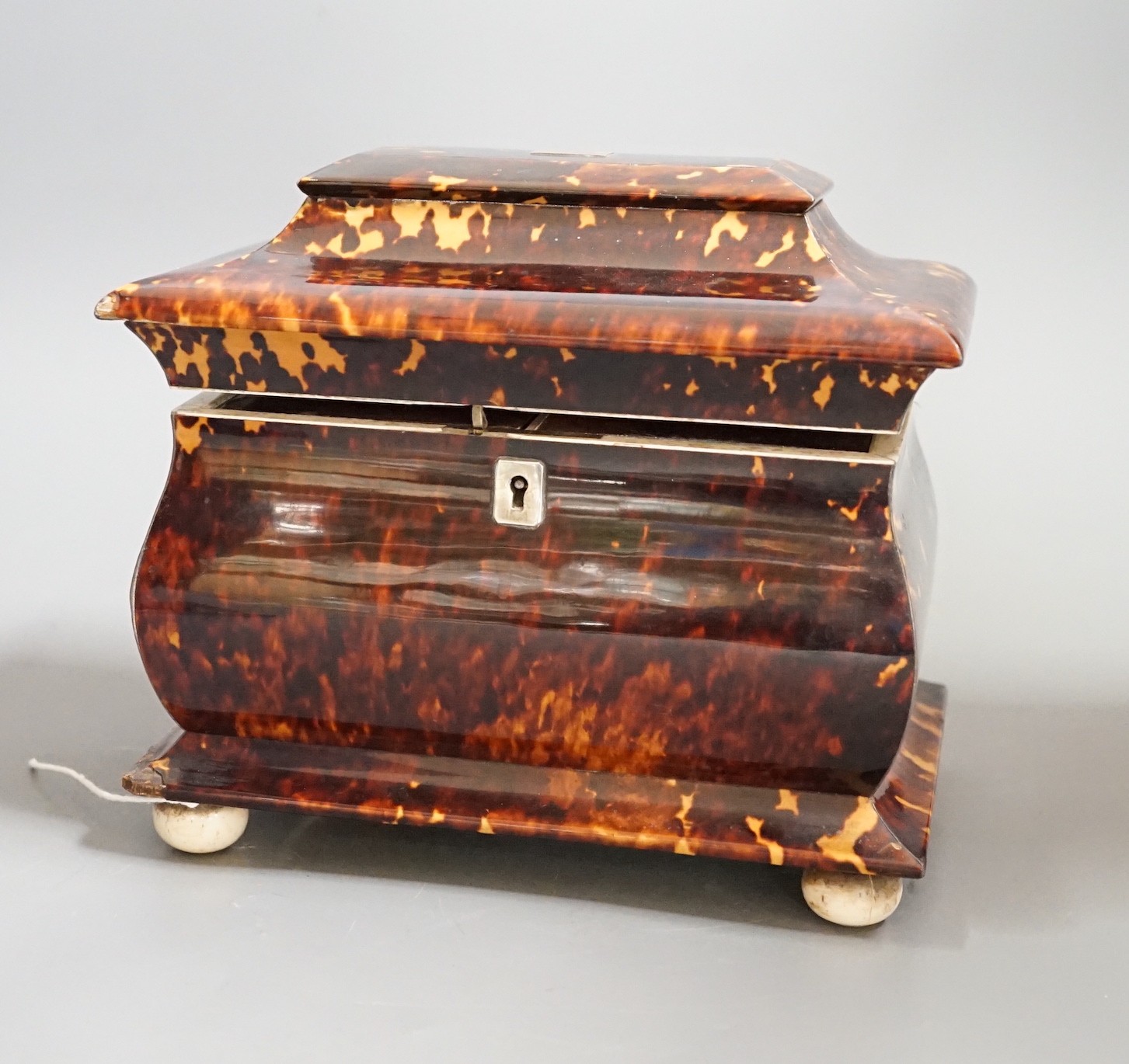 A Victorian tortoiseshell and ivory mounted tea caddy, 18cms high